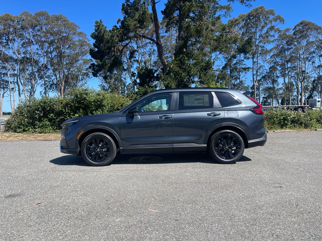 2026 Honda CR-V Hybrid Sport Touring in Meteorite Gray Metallic — front three-quarter view