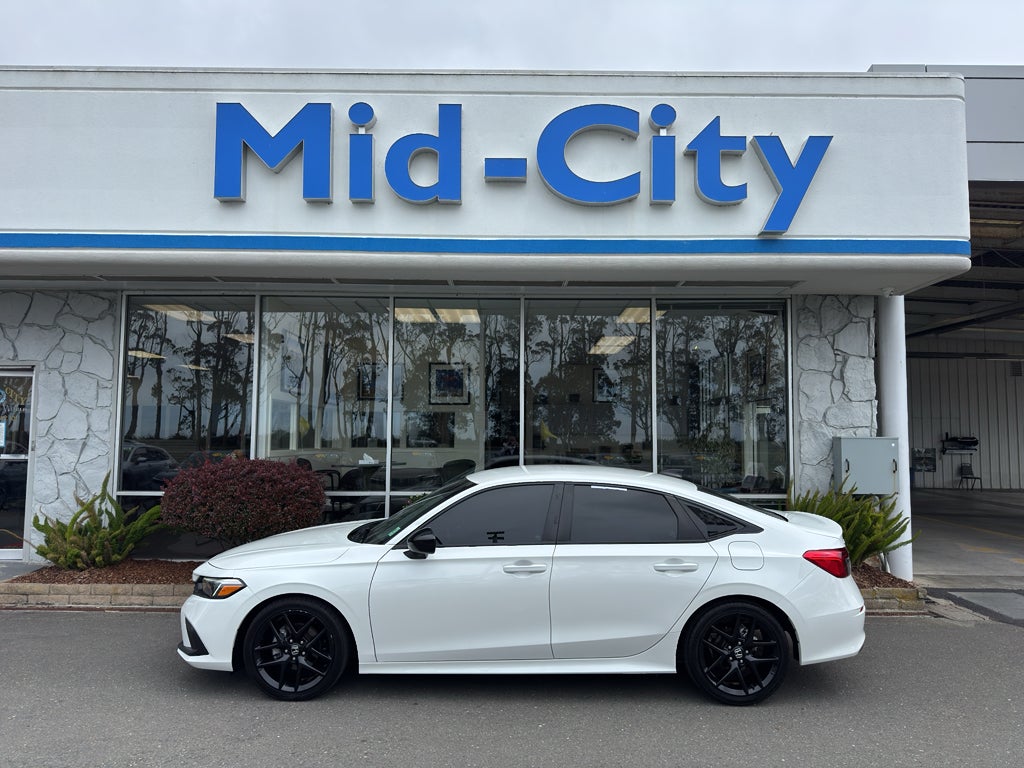 2024 Honda Civic Sport in Platinum White Pearl — front three-quarter view