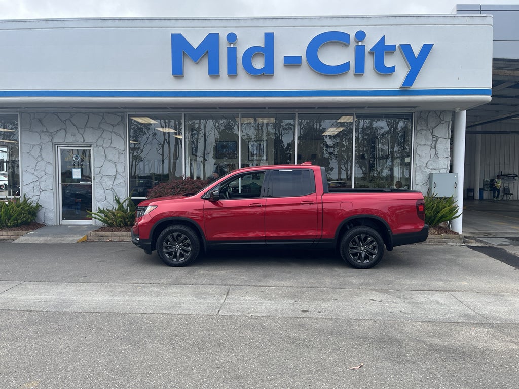 2023 Honda Ridgeline Sport in Radiant Red Metallic II — front three-quarter view