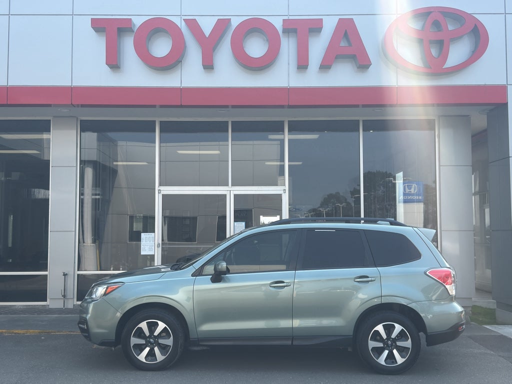 2018 Subaru Forester Premium in Jasmine Green Metallic — front three-quarter view