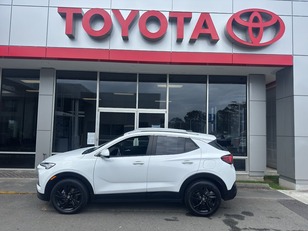 2024 Buick Encore GX Sport Touring in Summit White — front three-quarter view